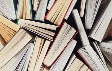 Many books textured background, top view. Multicolored books